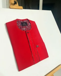 A tomato red flat design senator Kaftan with black Swarovski button African Kaftan