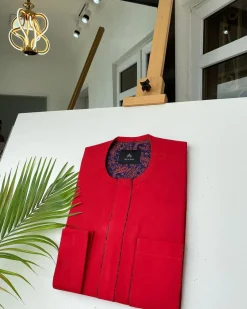 A Tomato Red Kaftan, With mixed blue and red paisley detailing and sokoto