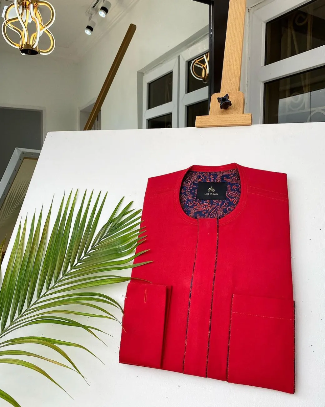 A Tomato Red Kaftan, With mixed blue and red paisley detailing and sokoto