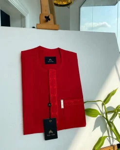 A tomato red, slanted vertical front flap & pocket embroidery detailing african traditional senator kaftan native.