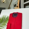 A Tomato-Red Kaftan With mixed blue and red paisley detailing