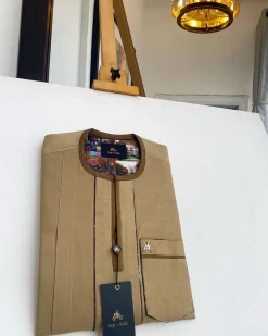 A Tortilla and brunette brown mix, patch pocket, and zipline flap detail African traditional senator kaftan native