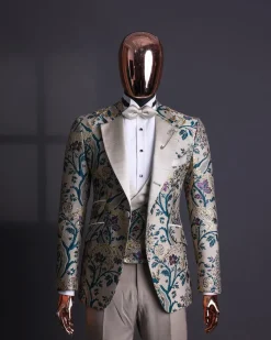 A Tortilla brown, emerald green, gold and splash of burgundy metallic floral jacquard peak lapel tuxedo suit