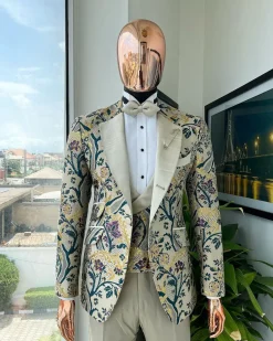 A Tortilla brown, emerald green, gold and splash of burgundy metallic floral jacquard peak lapel tuxedo suit