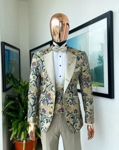 A Tortilla brown, emerald green, gold and splash of burgundy metallic floral jacquard peak lapel tuxedo suit