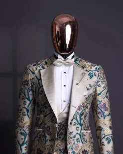 A Tortilla brown, emerald green, gold and splash of burgundy metallic floral jacquard peak lapel tuxedo suit