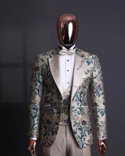 A Tortilla brown, emerald green, gold and splash of burgundy metallic floral jacquard peak lapel tuxedo suit
