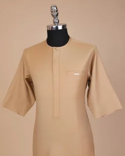A Tortilla brown, front flap with Swarovski button, 3/4 sleeve African senator kaftan native.