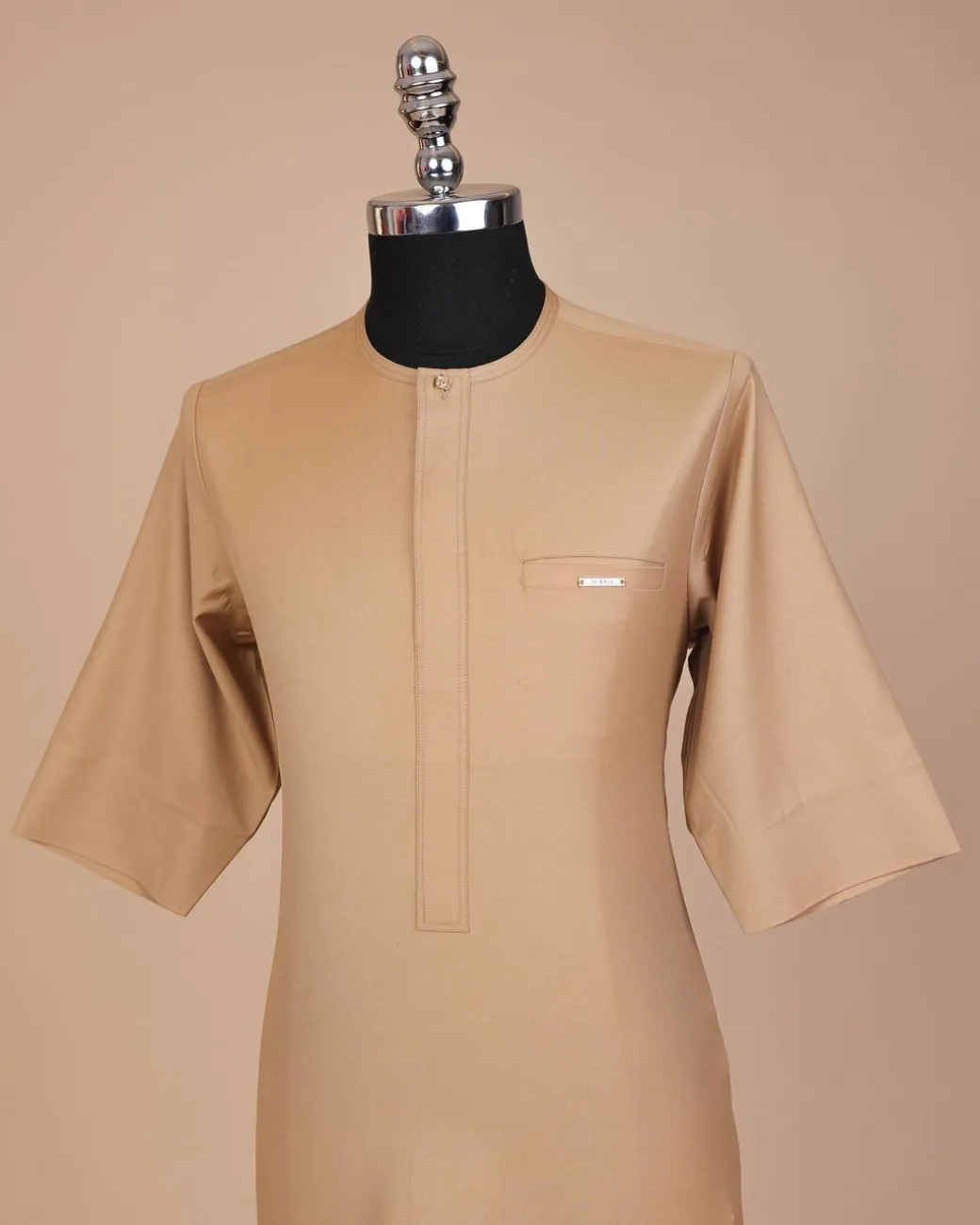 A Tortilla brown, front flap with Swarovski button, 3/4 sleeve African senator kaftan native.