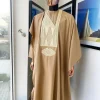 A Tortilla Brown, interconnected embroidery details agbada, buba and sokoto