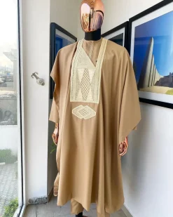A Tortilla Brown, interconnected embroidery details agbada, buba and sokoto