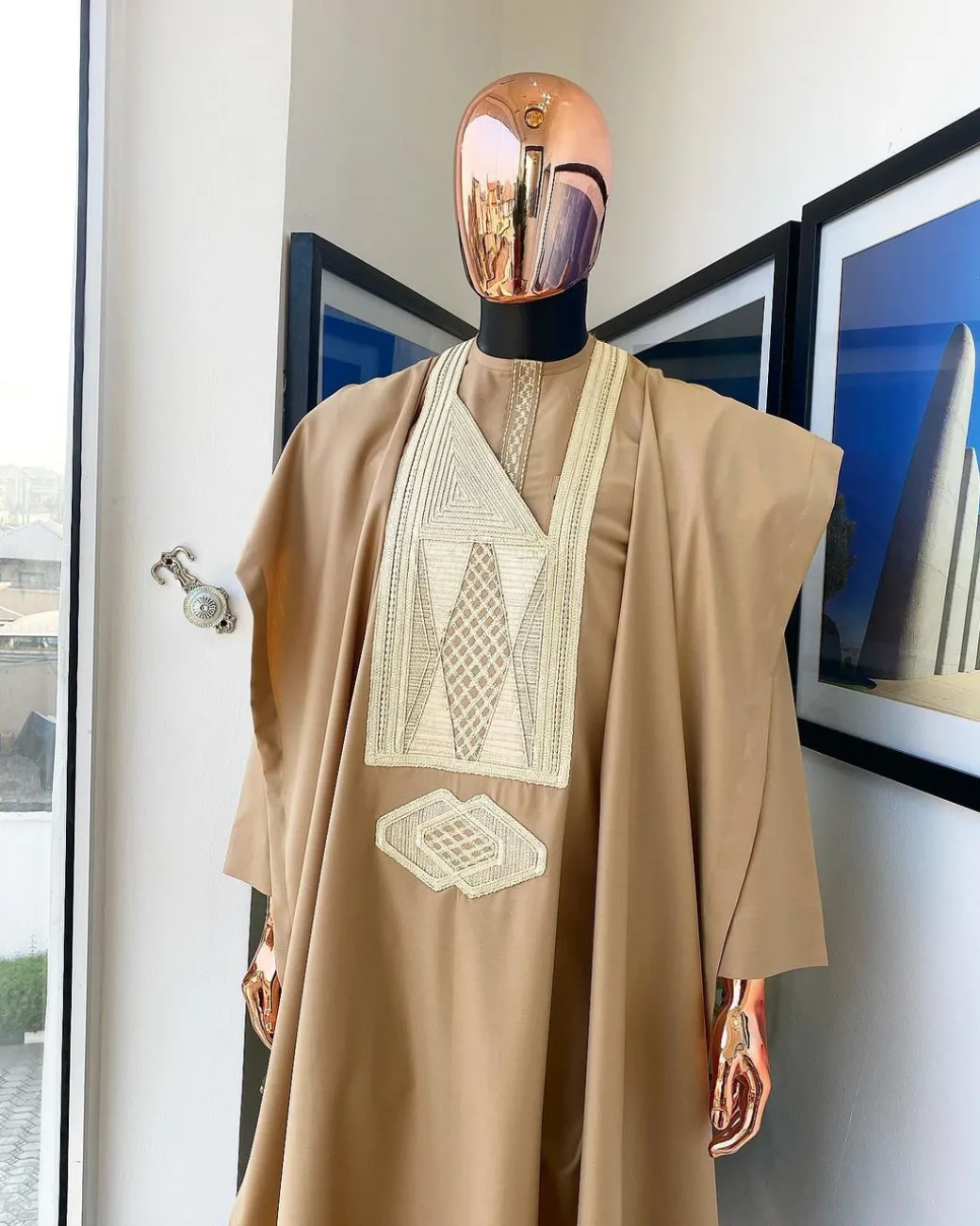 A Tortilla Brown, interconnected embroidery details agbada, buba and sokoto