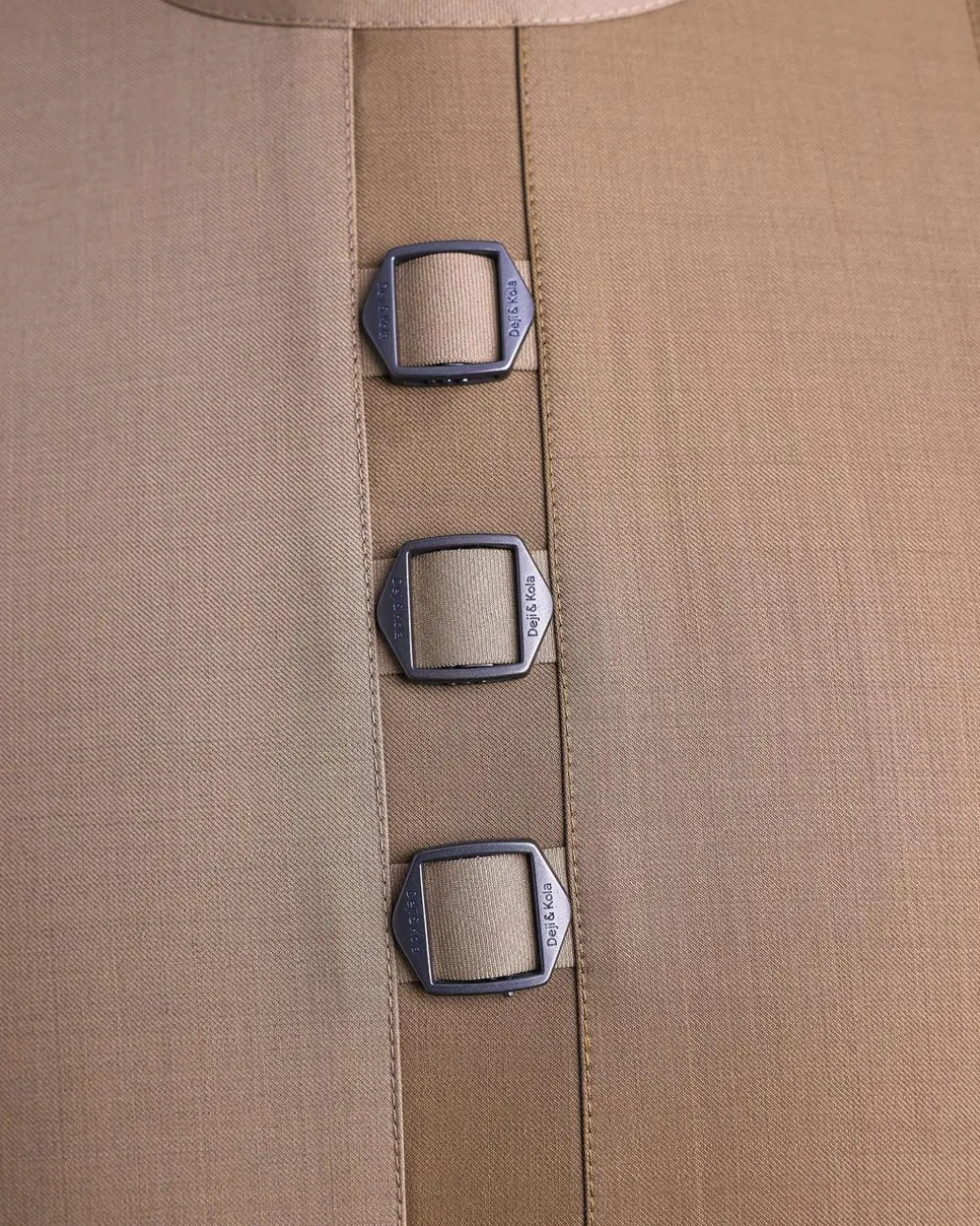 A Tortilla brown, invisible zip, black connected metal tag, 3/4 sleeve traditional african senator kaftan native.