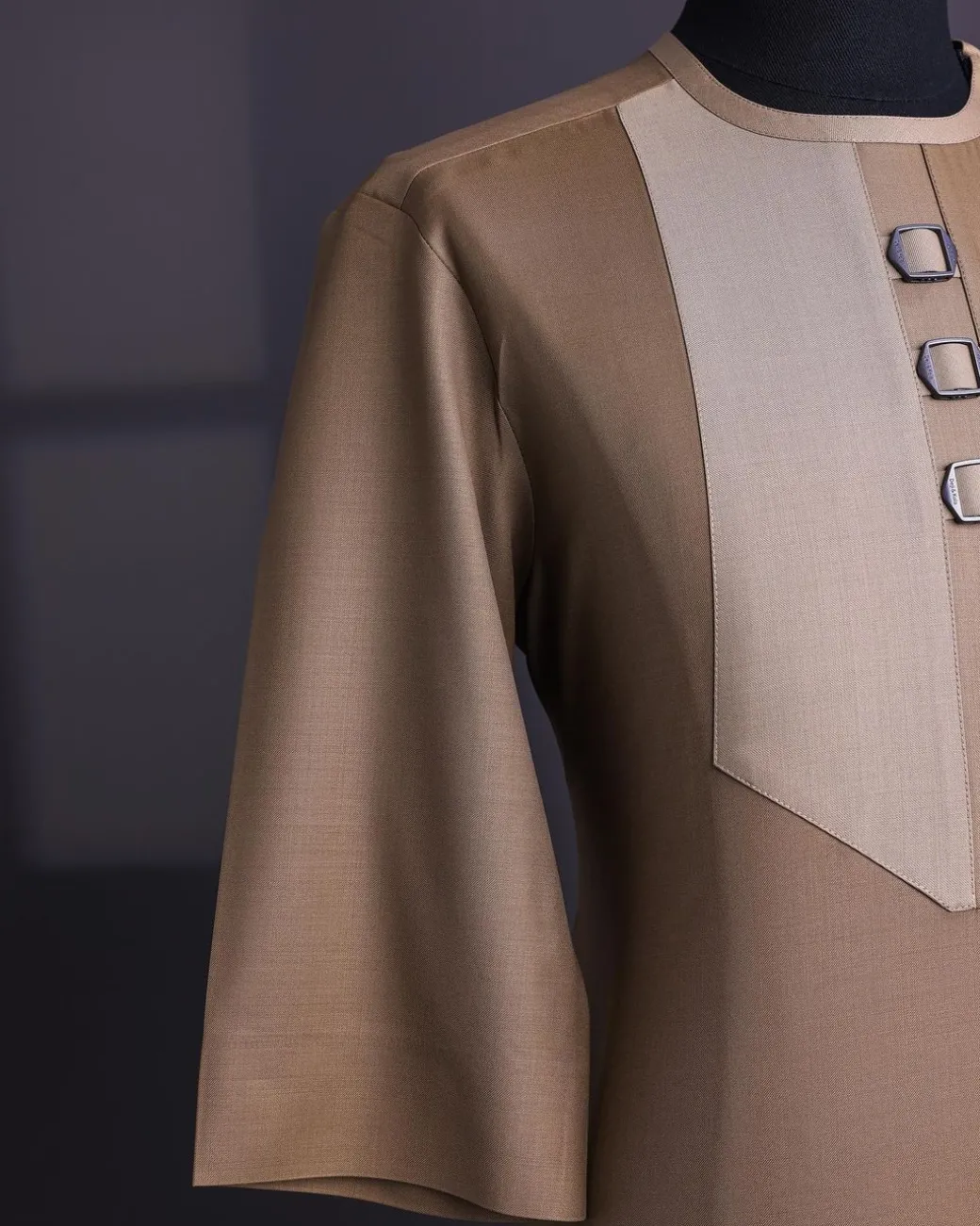 A Tortilla brown, invisible zip, black connected metal tag, 3/4 sleeve traditional african senator kaftan native.