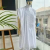 A voil jacquard cocaine white with an aligned square pattern design Agbada