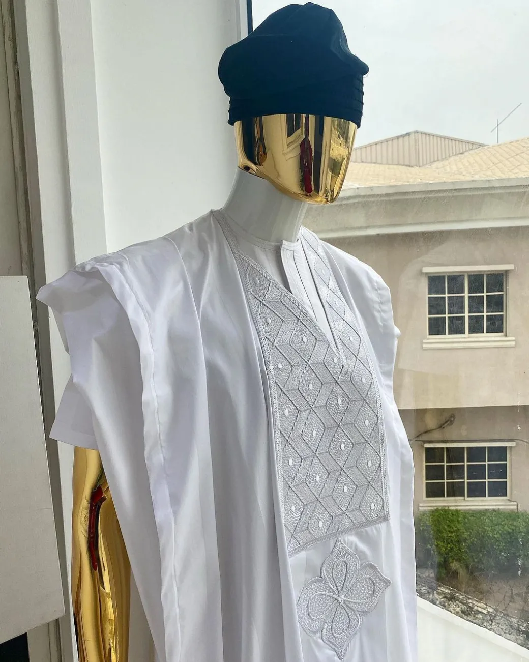 A voil jacquard cocaine white with an aligned square pattern design Agbada