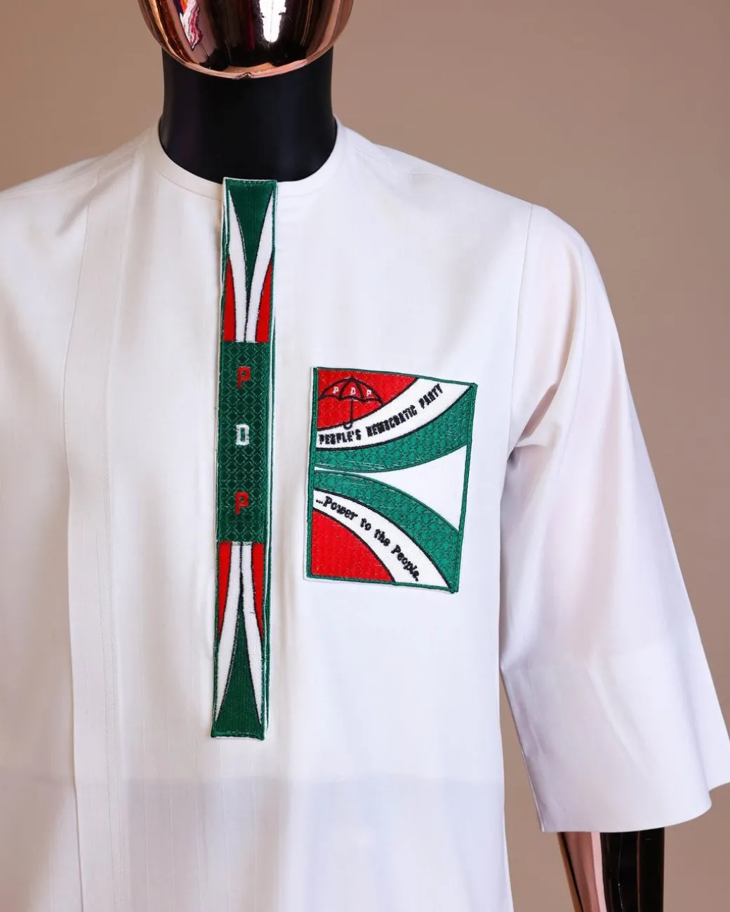 A white , PDP (People Democratic Party) pattern embroidery, 3/4 sleeve African senator kaftan native.