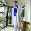 A white Agbada with royal blue embroidery detailing and royal blue Swarovski stone with hand woven Aboki hat
