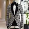 A White and black houndstooth, velvet shawl lapel tuxedo suit