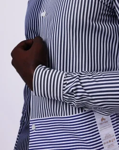A White And Blue Mixed Stripe Shirt.