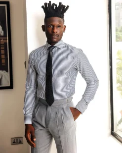 A White and blue stripe, cut-away collar business shirt.