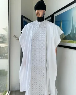 A white, connected square embroidery design with matching silver and black Swarovski stone details agbada
