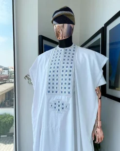 A white, connected square embroidery design with skye blue detailing Swarovski stone details agbada