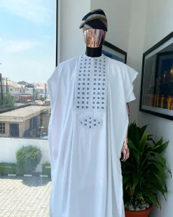 A white, connected square embroidery design with skye blue detailing Swarovski stone details agbada