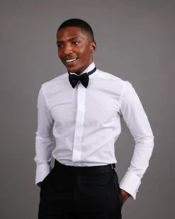 A White, covered button, connected paisley print wing collar tuxedo shirt.