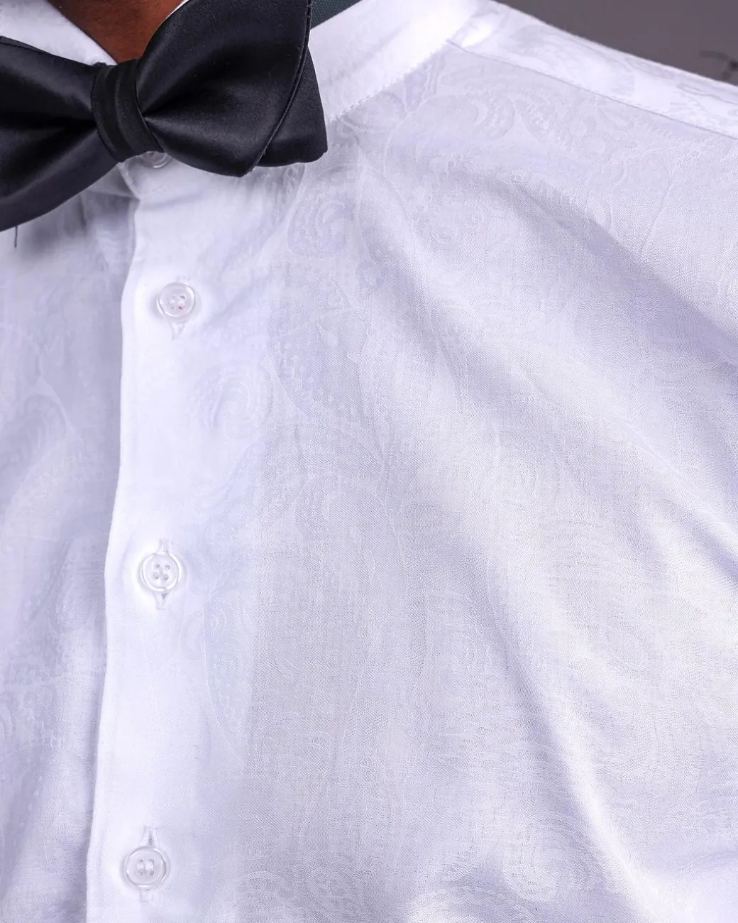 A White, Covered Button, Connected Paisley Print English Spread Collar Tuxedo Shirt.