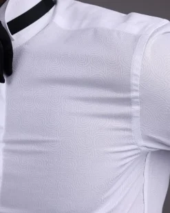 A White, covered button, connected paisley print wing collar tuxedo shirt.