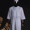 A White, curved and square shaped pocket with floral embrodery details, 3/4 sleeve African senator kaftan native.