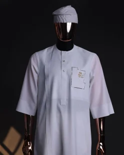 A White, curved and square shaped pocket with floral embrodery details, 3/4 sleeve African senator kaftan native.