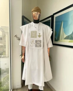 A white, dripping stars and interconnected maze embroidery details agbada