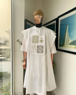 A white, dripping stars and interconnected maze embroidery details agbada