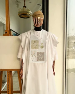 A white, dripping stars and interconnected maze embroidery details agbada