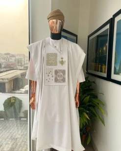 A white, dripping stars and interconnected maze embroidery details agbada
