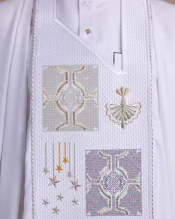 A white, dripping stars and interconnected maze embroidery details agbada