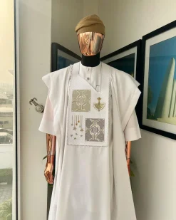 A white, dripping stars and interconnected maze embroidery details agbada