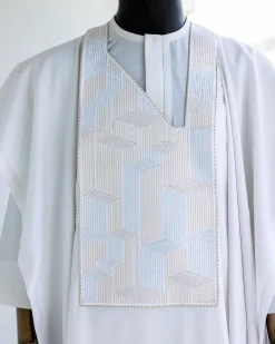 A White, dropping maze line embroidery details agbada, 3/4 sleeve kaftan, and Sokoto