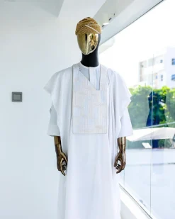 A White, dropping maze line embroidery details agbada, 3/4 sleeve kaftan, and Sokoto