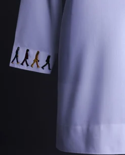 A White, front flap with mixed Swarovski buttons, patch pocket, free hand cuff with (keep walking) embroidery detailing African senator kaftan native.