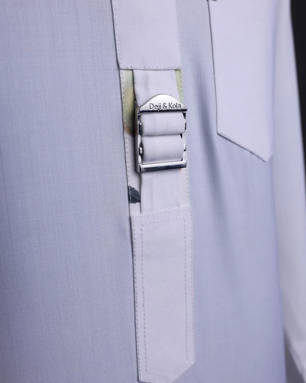 A White, front flap,interwoven buckle, Long sleeve African senator kaftan native.