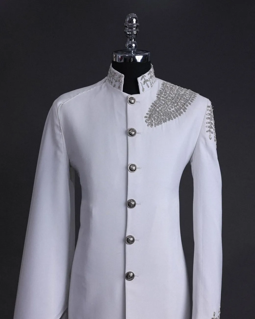 A white, hand “ide” silver metal wire embroidery, right hand sache safari suit