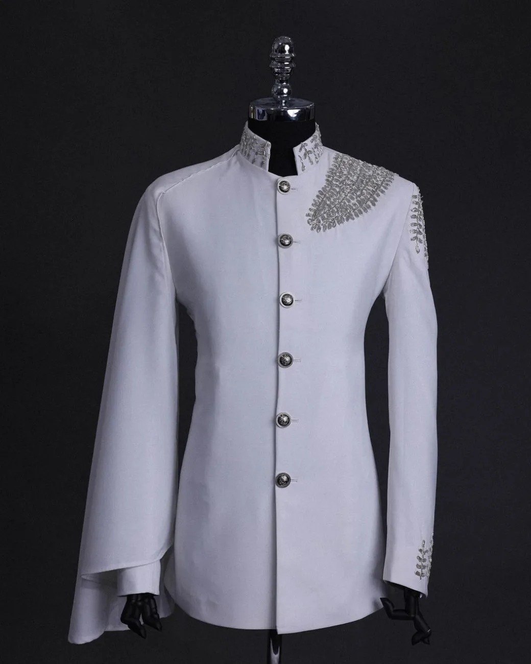 A white, hand “ide” silver metal wire embroidery, right hand sache safari suit