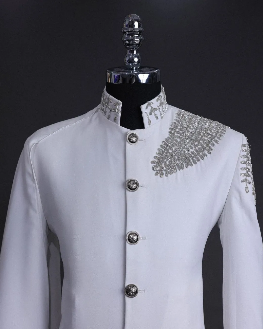 A white, hand “ide” silver metal wire embroidery, right hand sache safari suit
