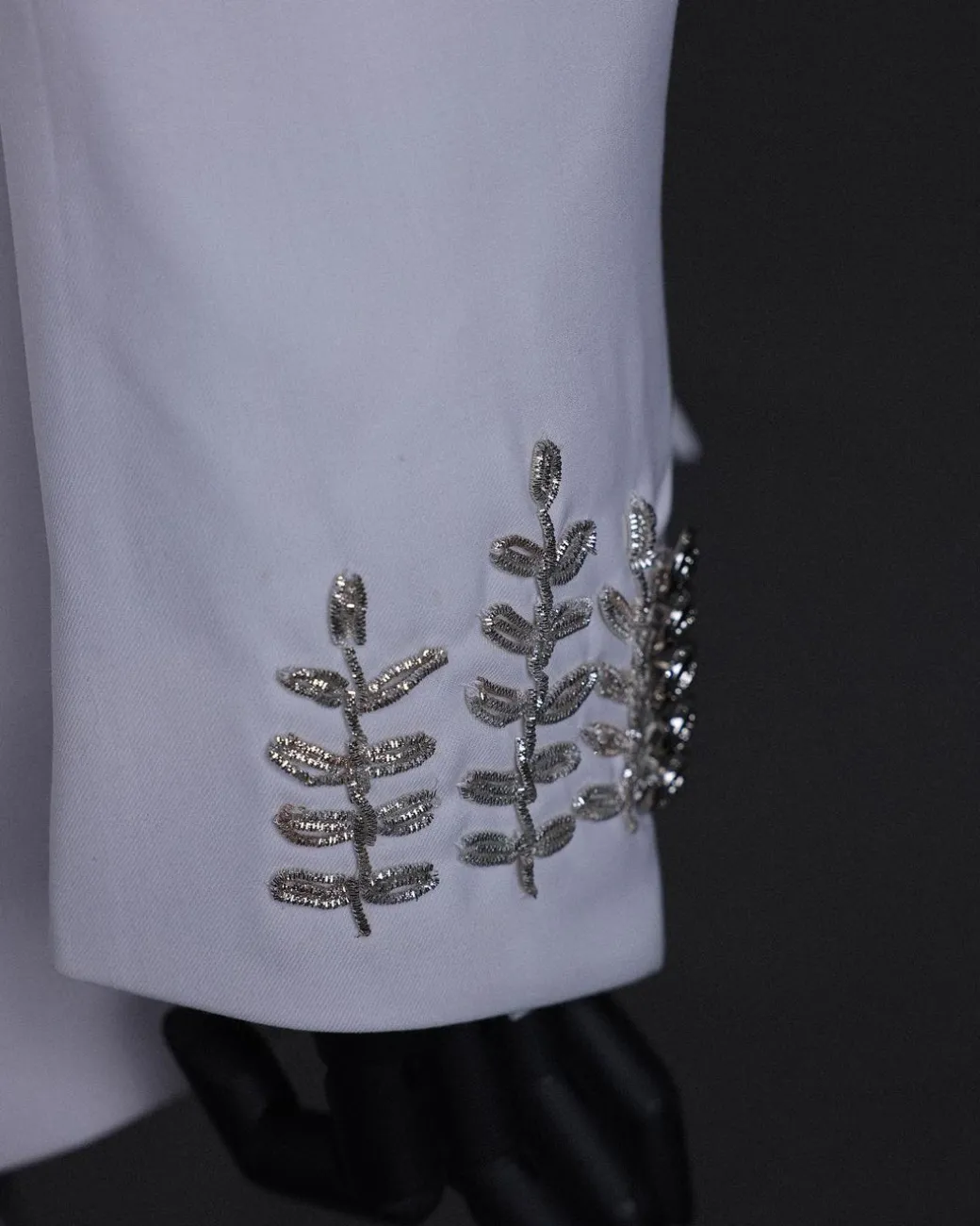 A white, hand “ide” silver metal wire embroidery, right hand sache safari suit