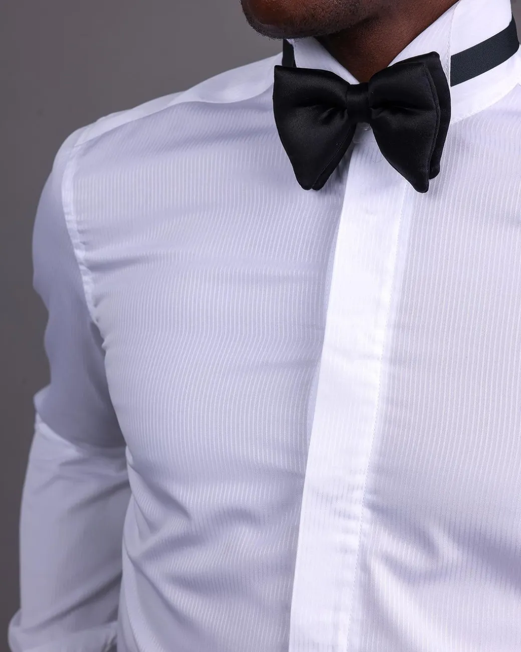 A White, Layered Stripe, Covered Buttons Tuxedo Shirt.
