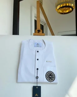 A white mix kaftan, button front flap, hand embroidery patch and black Swarovski detailing African Kaftan and Sokoto