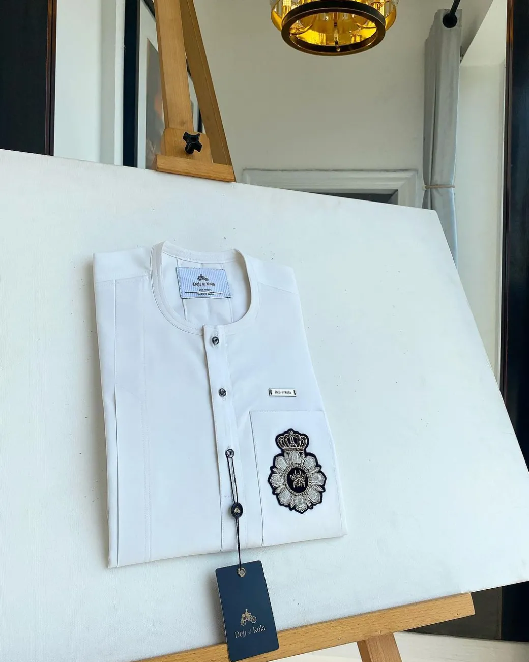 A White, patch pocket, front flap with clear view jet black Swarovski button details African kaftan